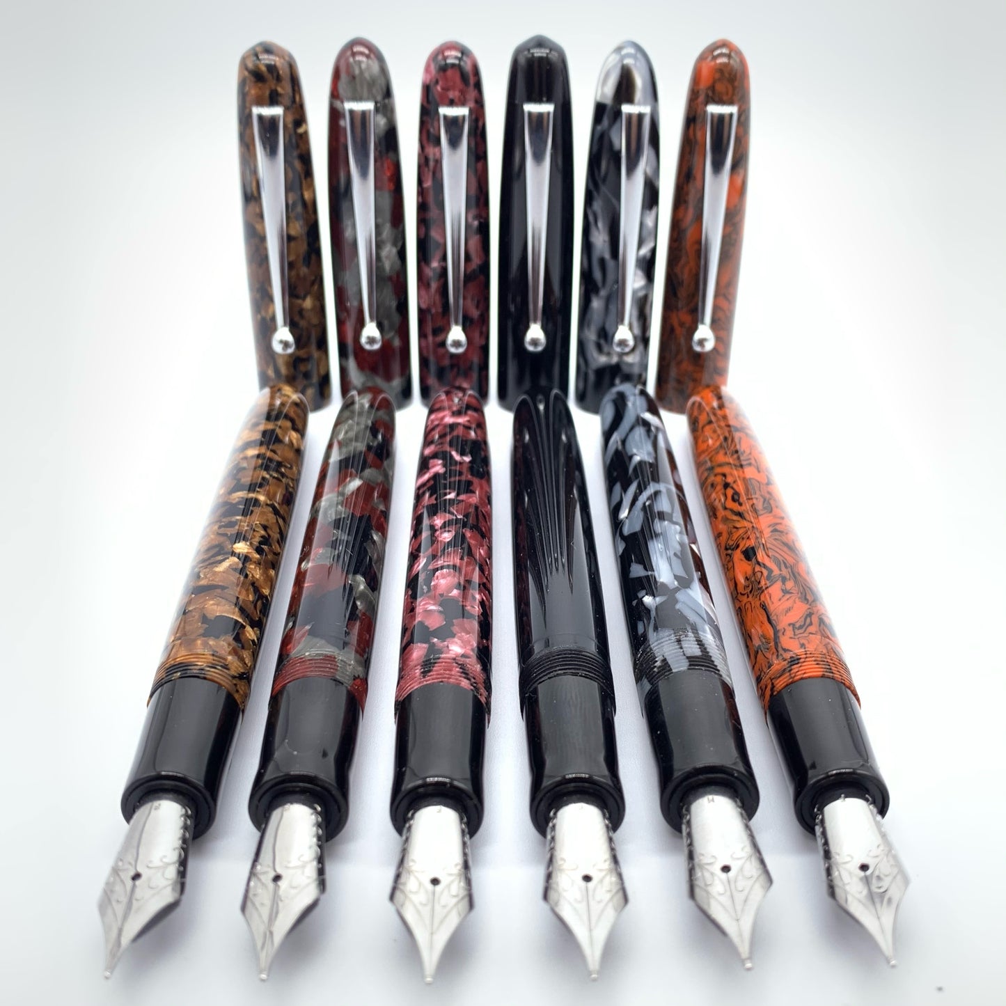 Vintage Italiano cellulose acetate in six different styles. Black Ebonite section and chrome clips.